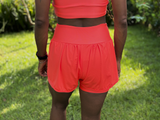 SHORTS DUPLO LYCRA E POLIAMIDA TECIDO CANELADO COM BOLSOS LATERAIS PATIMODAFITNESS  Laranja neon