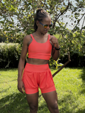 SHORTS DUPLO LYCRA E POLIAMIDA TECIDO CANELADO COM BOLSOS LATERAIS PATIMODAFITNESS  Laranja neon