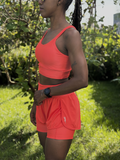SHORTS DUPLO LYCRA E POLIAMIDA TECIDO CANELADO COM BOLSOS LATERAIS PATIMODAFITNESS  Laranja neon