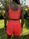 SHORTS DUPLO LYCRA E POLIAMIDA TECIDO CANELADO COM BOLSOS LATERAIS PATIMODAFITNESS  Laranja neon